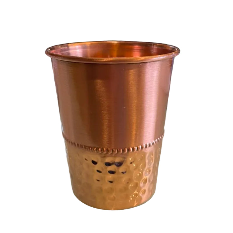 Copper hammered drinking cup with flared rim and dimpled texture