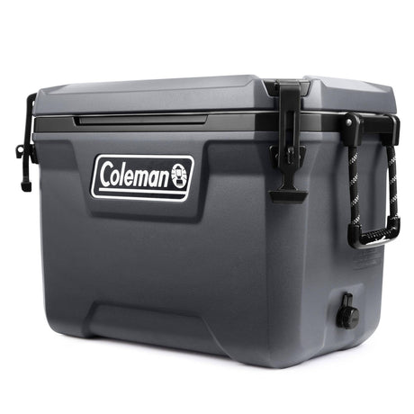 Gray Coleman insulated cooler with flip-up lid latch and side handles, studio view