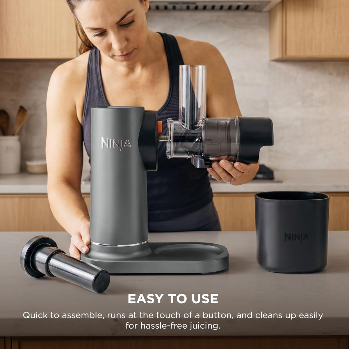 Ninja NeverClog cold press juicer with chute and feed cylinder, assembled on counter