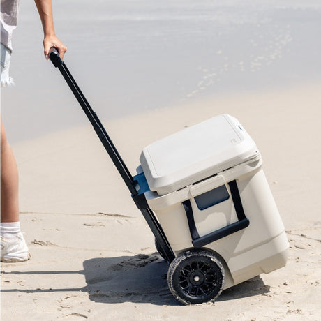 White wheeled ice cooler with extended handle and large tires