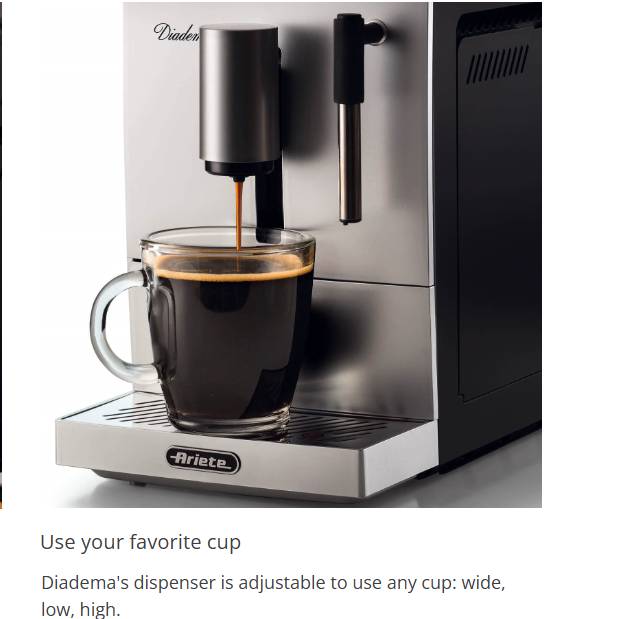 Black espresso coffee machine dispensing into a glass cup with steam spout