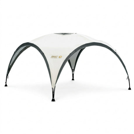 Large white event tent with curved dark frame and arched front doorway