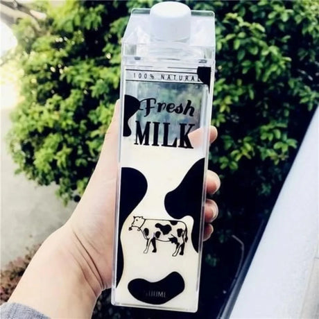Clear plastic 500ml milk bottle with white cap, Fresh Milk label and cow graphic