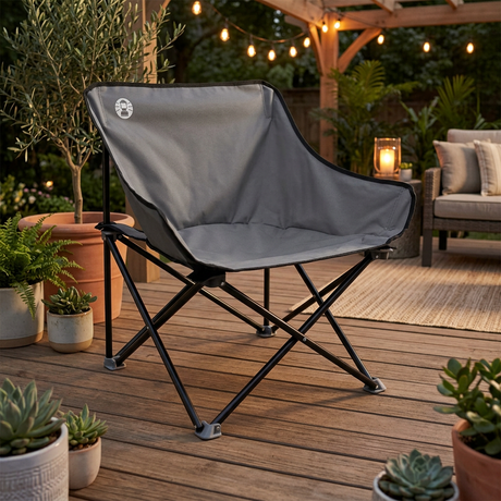 Coleman kick back chair with gray fabric seat and black steel folding frame