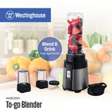 Westinghouse To-go blender with blending cup holding fruit