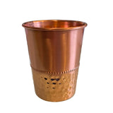 Copper hammered drinking cup with flared rim and dimpled texture