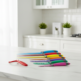 8-piece knife set with multicolor handles and blades, laid on countertop