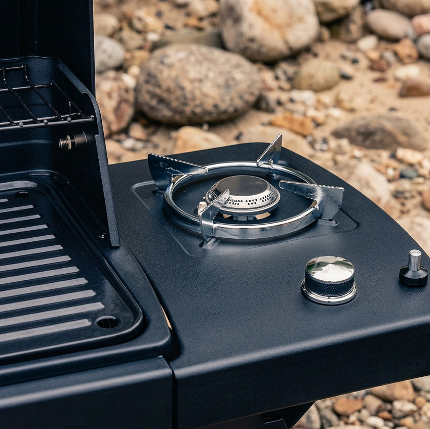 Side burner on compact BBQ grill with circular gas grate and control knob