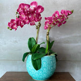Pink Orchid Arrangement In Blue Turquoise Vase